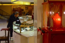 A security guard looks at the diamonds at the rows of jewelry shops that occupy the streets of Yu Garden.